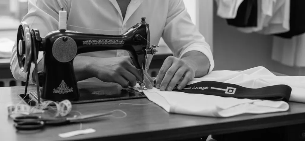 Man making Levage underwear with sewing machine